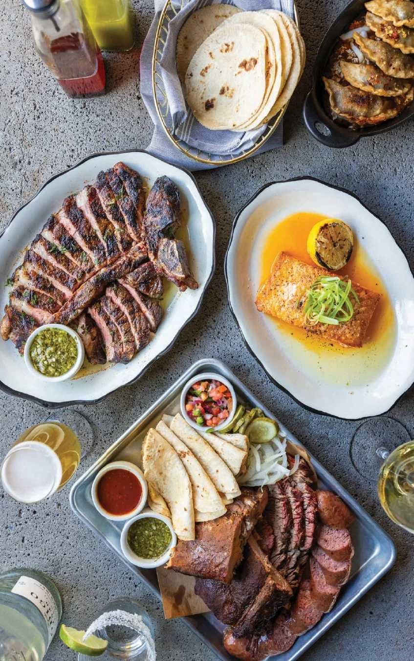 Grilled steak, salmon, and a smoked-meat platter at Butchertown Hall