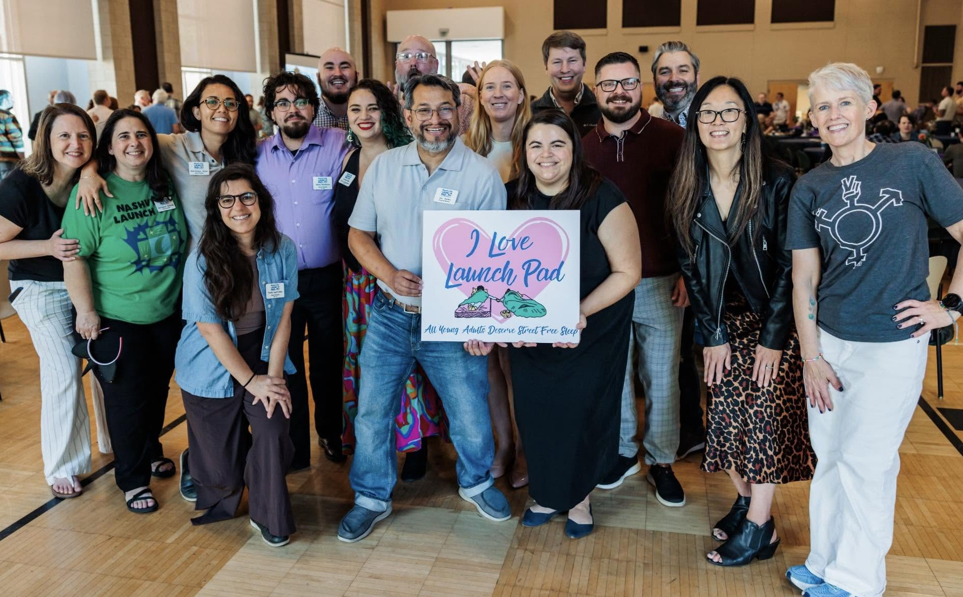 The Nashville Launch Pad team holding an I Love Launch Pad sign